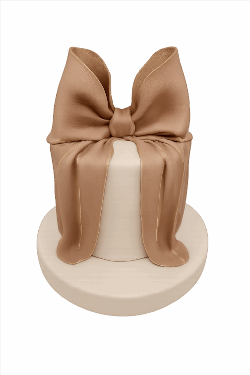 gâteau élégant style luxe avec ruban géant et finitions dorées