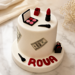 Gâteau anniversaire maquillage et luxe blanc avec rouge à lèvres palette fard et billets de banque personnalisé par Deluxe Pâtisserie Tunis